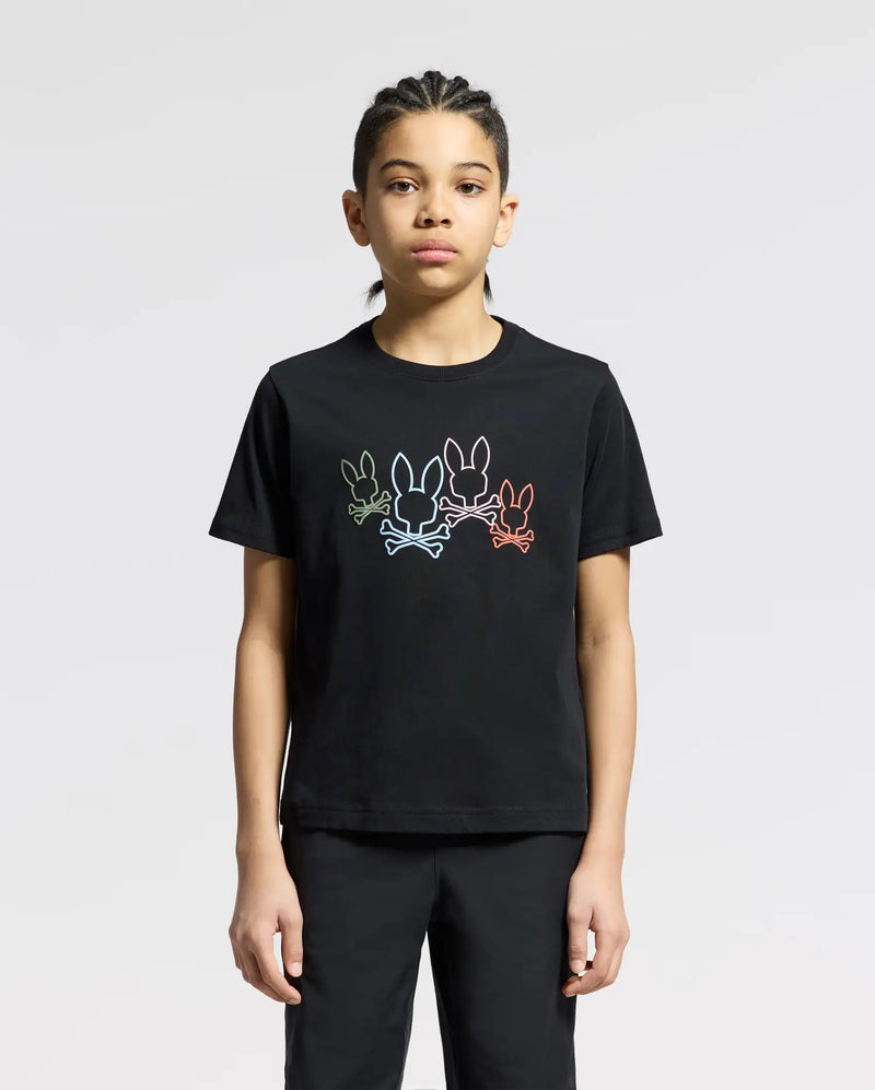 A person wears the Psycho Bunny KIDS SILVERDALE GRAPHIC TEE, featuring a vibrant bunny graphic with colorful outlines of three rabbits on soft Pima cotton. They stand against a plain background, their braided hair and neutral expression adding understated elegance.