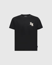 The KIDS ELLIOT FRONT BACK GRAPHIC TEE by Psycho Bunny is a black Pima cotton T-shirt featuring a small white embroidery near the left neckline. This simple piece has short sleeves and a round neck, combining premium comfort with style.