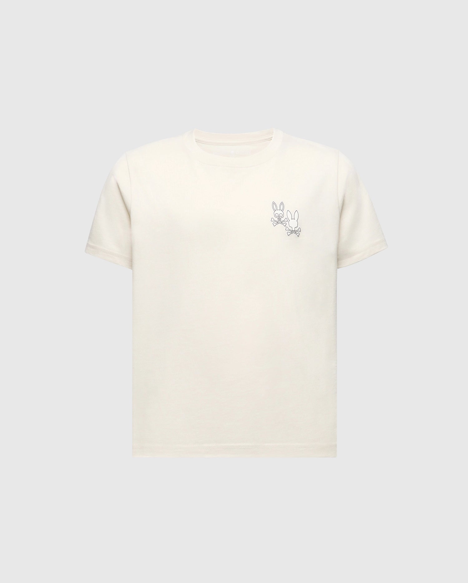 The Psycho Bunny KIDS ELLIOT FRONT BACK GRAPHIC TEE (B0U605F200) is a light beige Pima cotton shirt featuring an eco-friendly water-based print of a simple cartoon rabbit line drawing on the upper left, set against a plain grey background.