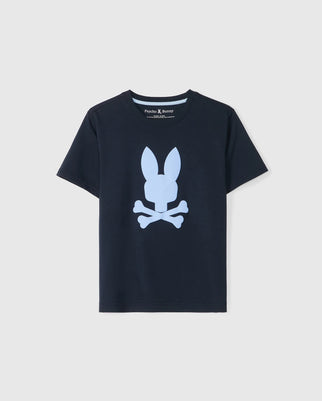 A black KIDS HOUSTON GRAPHIC TEE - B0U607C200 with a large white bunny print head above crossed bones on the front. The neckline is round, and the sleeves are short. The tag inside the collar reads "Psycho Bunny." The background is a plain light gray.