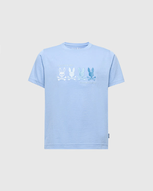 The KIDS OCEANIA EMBROIDERED GRAPHIC TEE - B0U607F200 from Psycho Bunny is a light blue Pima Cotton shirt featuring retro line-drawn bunnies in various shades above crossed bones, with "PSYCHO BUNNY" and "ANTHROPOLOGIE" embroidered beneath the design.