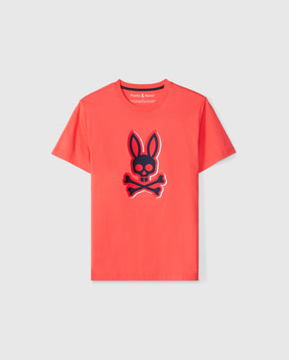 The KIDS KAYDEN GRAPHIC TEE - B0U676C200 from Psycho Bunny is a vibrant red Pima cotton shirt featuring a prominent black bunny skull with crossbones design on the front. This stylish graphic tee is showcased against a plain, light-colored background.