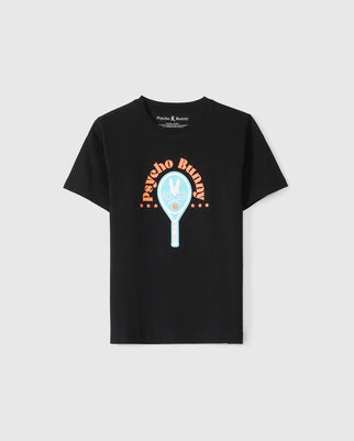 The KIDS COURTSIDE GRAPHIC TEE - B0U682C200 by Psycho Bunny is a black T-shirt featuring a graphic design in the center. The design showcases a blue and white tennis racket with the iconic bunny logo inside it. Above the racket, the words "Psycho Bunny" are curved in orange, flanked by orange stars on both sides. Perfect for young tennis enthusiasts, this tee stands out with its stylish and sporty look.