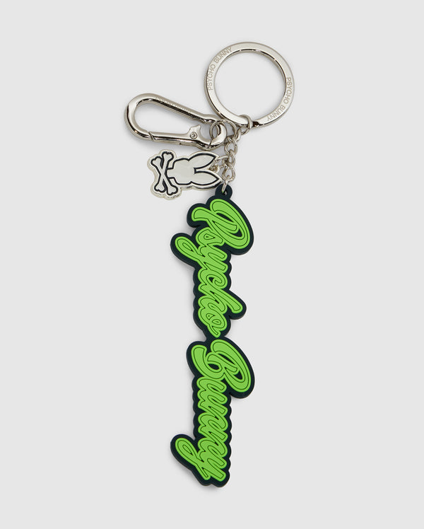 The Psycho Bunny SILICONE KEYCHAIN - B6A373E200 features a silver metal clasp, bunny-shaped charm, and a green and black rubber tag—perfect for daily use or any Psycho Bunny fan.