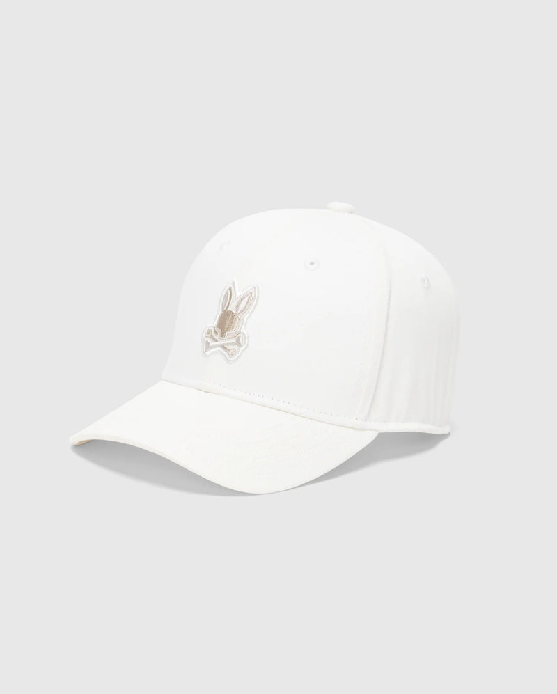 The Psycho Bunny MENS NEW CASTLE EMBROIDERED GRAPHIC BASEBALL CAP - B6A547F200 showcases a beige rabbit embroidery on a white cotton twill, offering an essence of quiet luxury against a plain gray background.