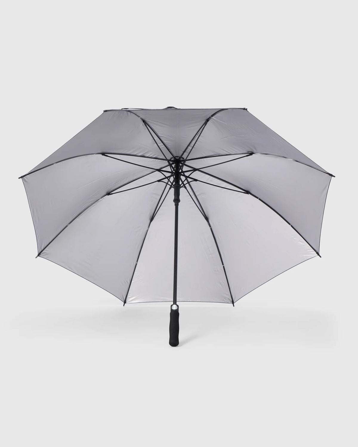 A grey Psycho Bunny GOLF UMBRELLA - B6A624C200 with a black handle and metal ribs is fully open against a plain white background. The umbrella has a classic design and appears sturdy, making it an ideal reliable umbrella for die-hard golfers seeking protection against rain.
