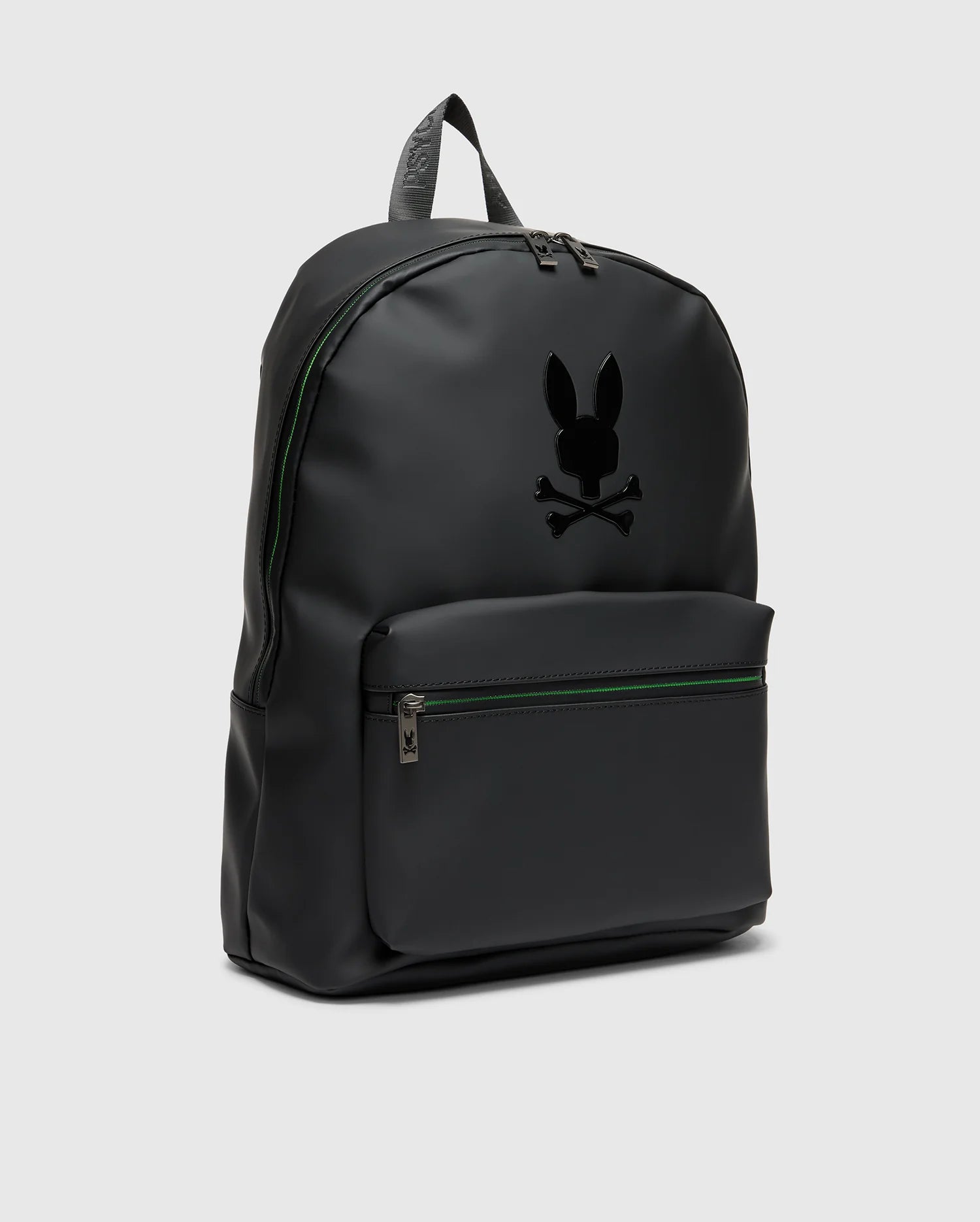 The MENS RUBBERIZED BACKPACK - B6A637F200 from Psycho Bunny is sleek with a subtle gloss finish, offering both functionality and durability. It includes a front zipper pocket and spacious top pocket. The minimalist bunny with crossbones logo adds an edgy touch to its design.
