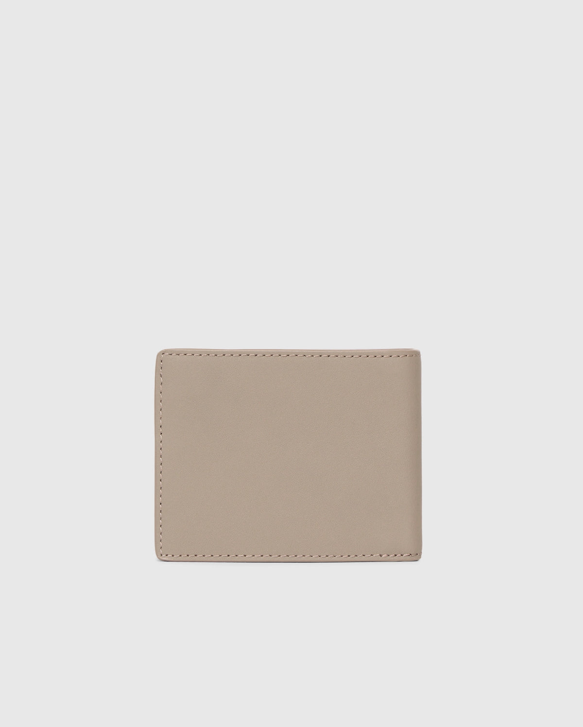 A Psycho Bunny MENS LEATHER WALLET - B6A868D200 in minimalist beige rests against a light gray backdrop. The closed wallet highlights its smooth, unadorned surface and precise stitching, exemplifying premium craftsmanship.