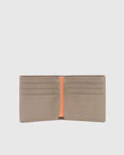 The MENS LEATHER WALLET - B6A868D200 by Psycho Bunny is open, showing six card slots with an orange center divider. The brand name is elegantly embossed in silver on the bottom right corner of this luxurious beige wallet's interior.