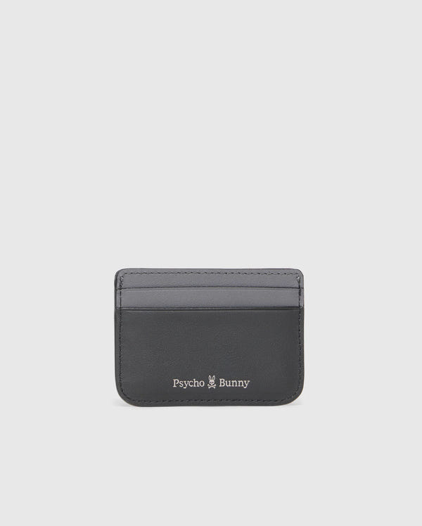 The Psycho Bunny MENS WORDMARK LEATHER CARD CASE - B6A869D200 is a sleek black leather card holder featuring the signature logo, a small white bunny graphic on the front, and two easy-access front card slots.