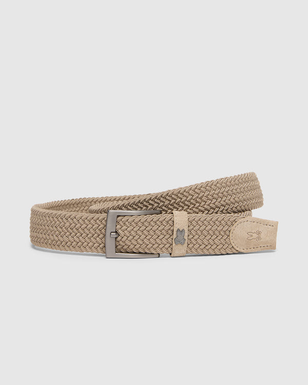 The Psycho Bunny MENS STRETCH BRAIDED BELT - B6A890F200 is showcased against a light backdrop, featuring a beige woven design with a silver rectangular buckle and detailed leather end tab—ideal for enhancing any outfit.