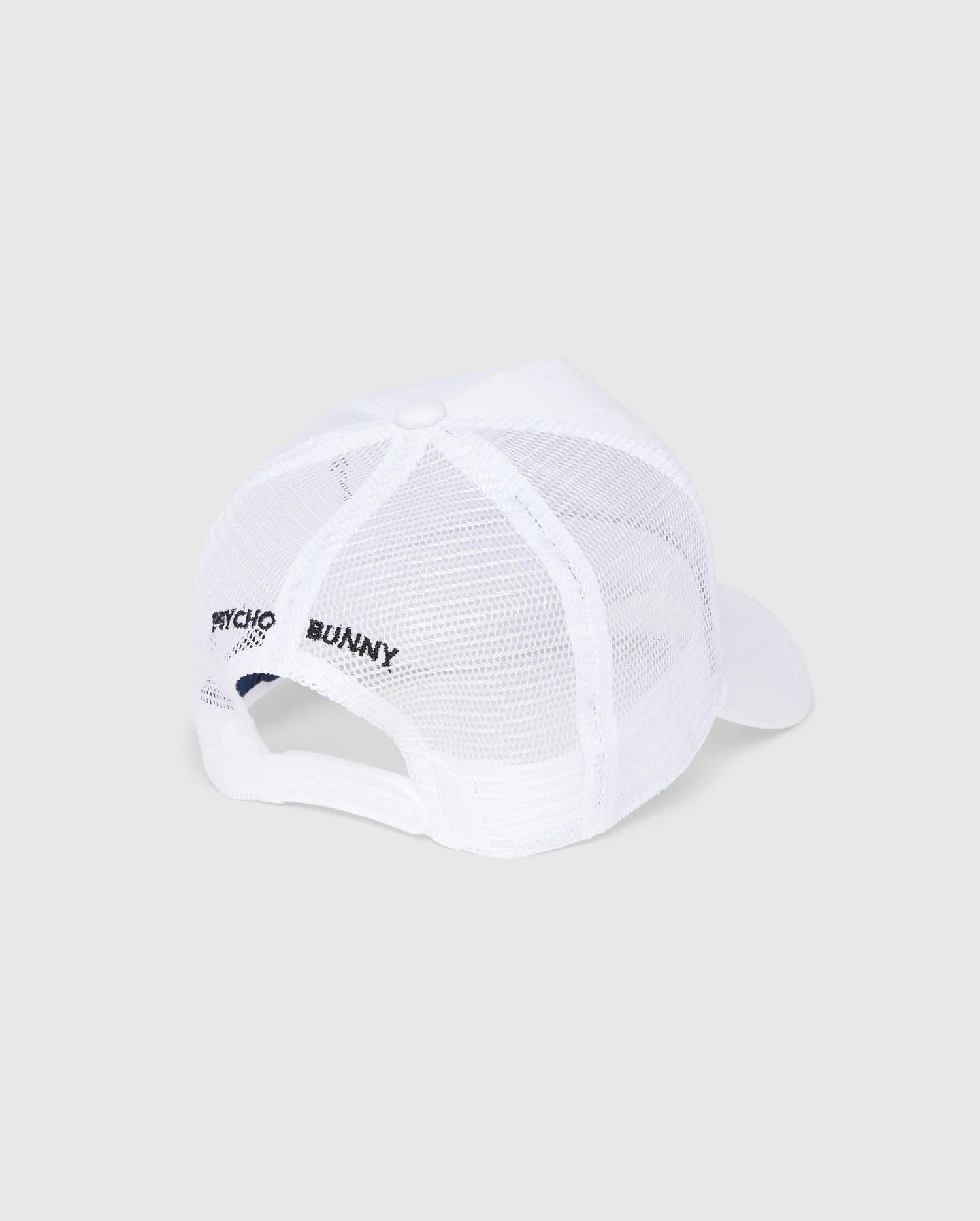 The MENS BUNNY PATCH TRUCKER CAP - B6A965C200 by Psycho Bunny is a white mesh baseball cap with a solid brim and adjustable strap. It features "Psycho Bunny" text on the side for a sporty, casual trucker hat style.
