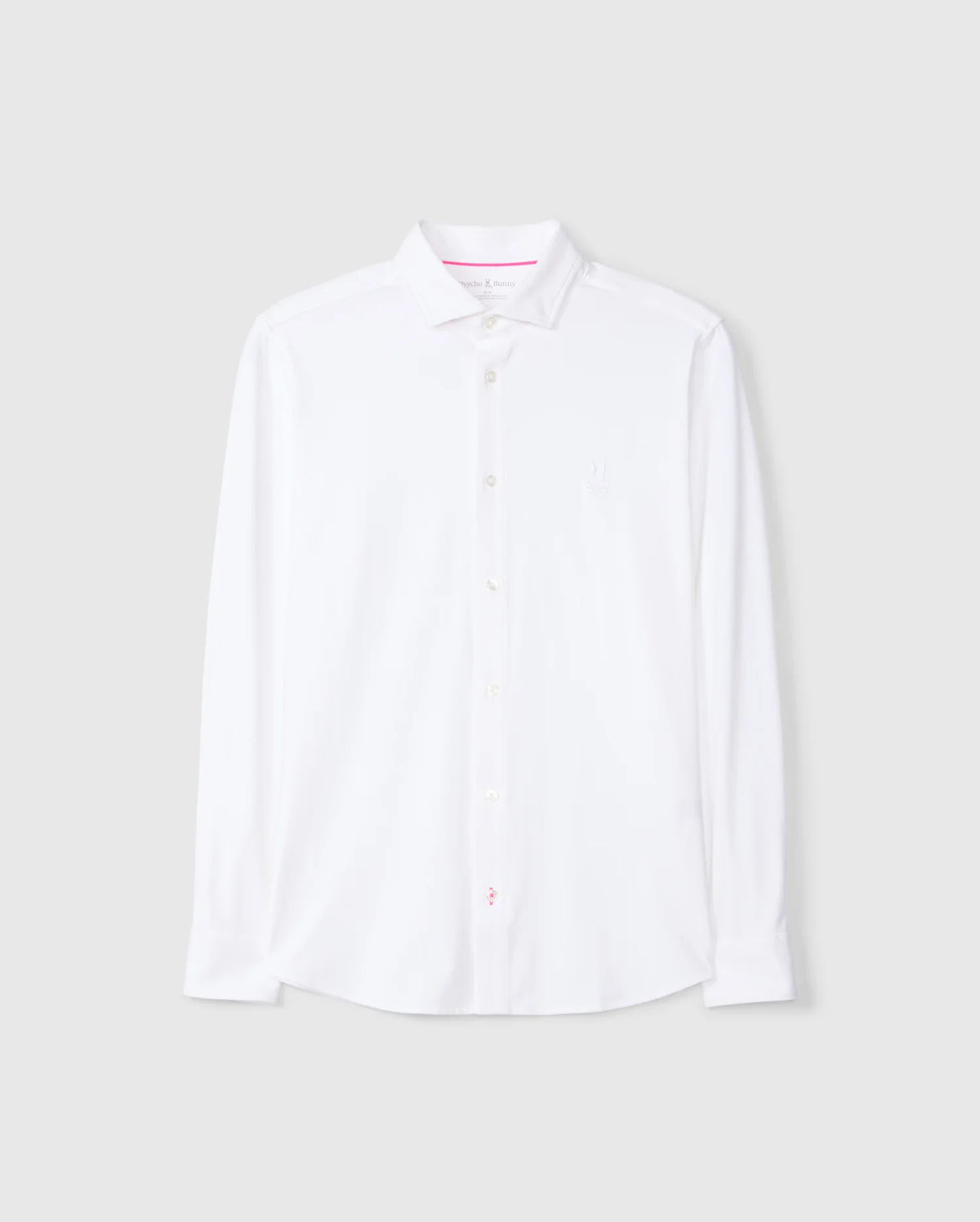 The MENS ARTHUR JERSEY SHIRT - B6C748D200, by Psycho Bunny, is a white long-sleeve button-up dress shirt crafted from premium stretch Pima cotton. Displayed against a light gray background, this shirt features a classic collar and boasts a clean, minimalist design with the brand logo subtly embroidered on the left chest.