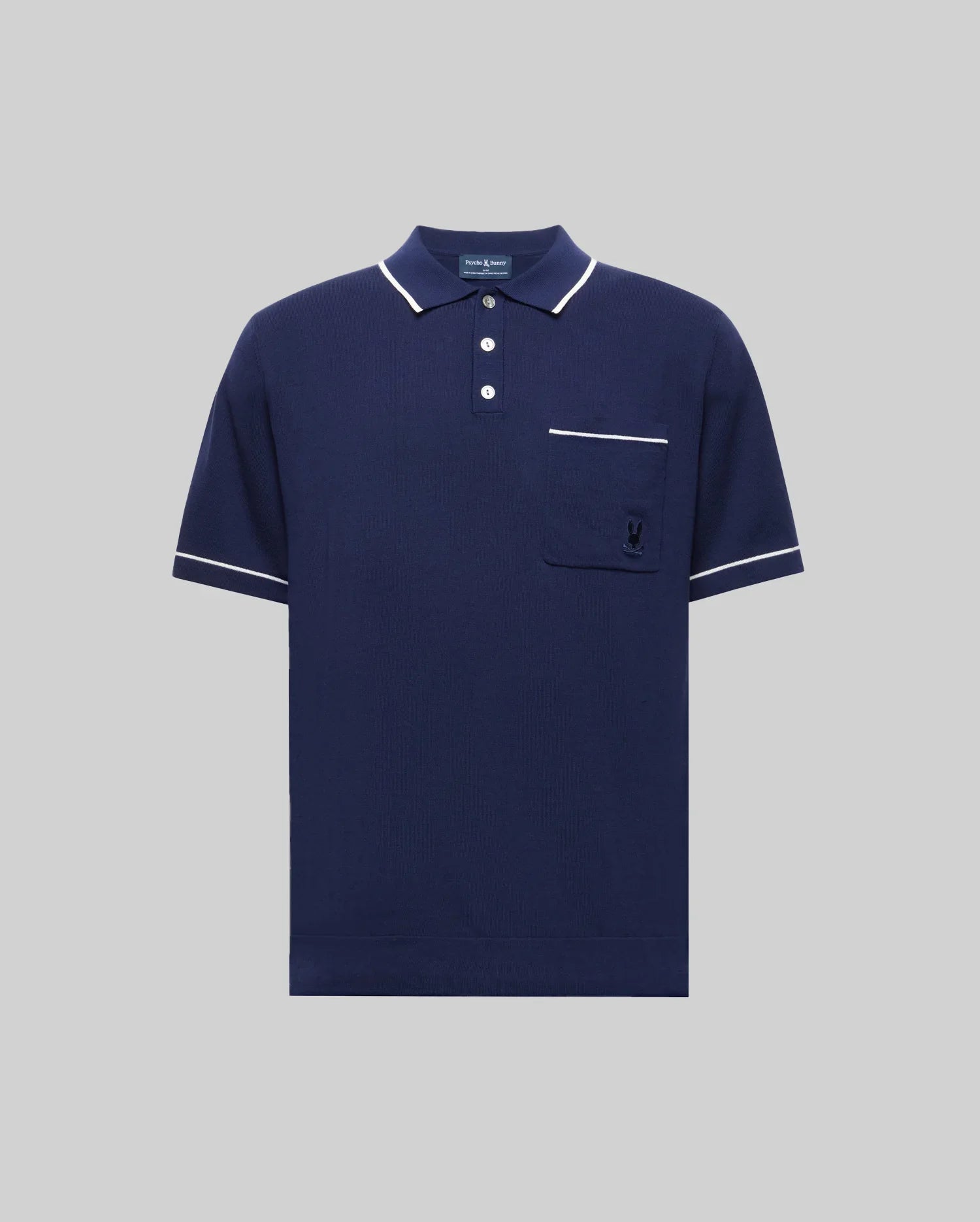 The Psycho Bunny Mens Longford Fine Knit Polo (B6E500F200) is a navy slim-fit polo in fine-knit jersey with white-trimmed collar, sleeves, and pocket, featuring a button placket and an embroidered logo on the chest pocket.