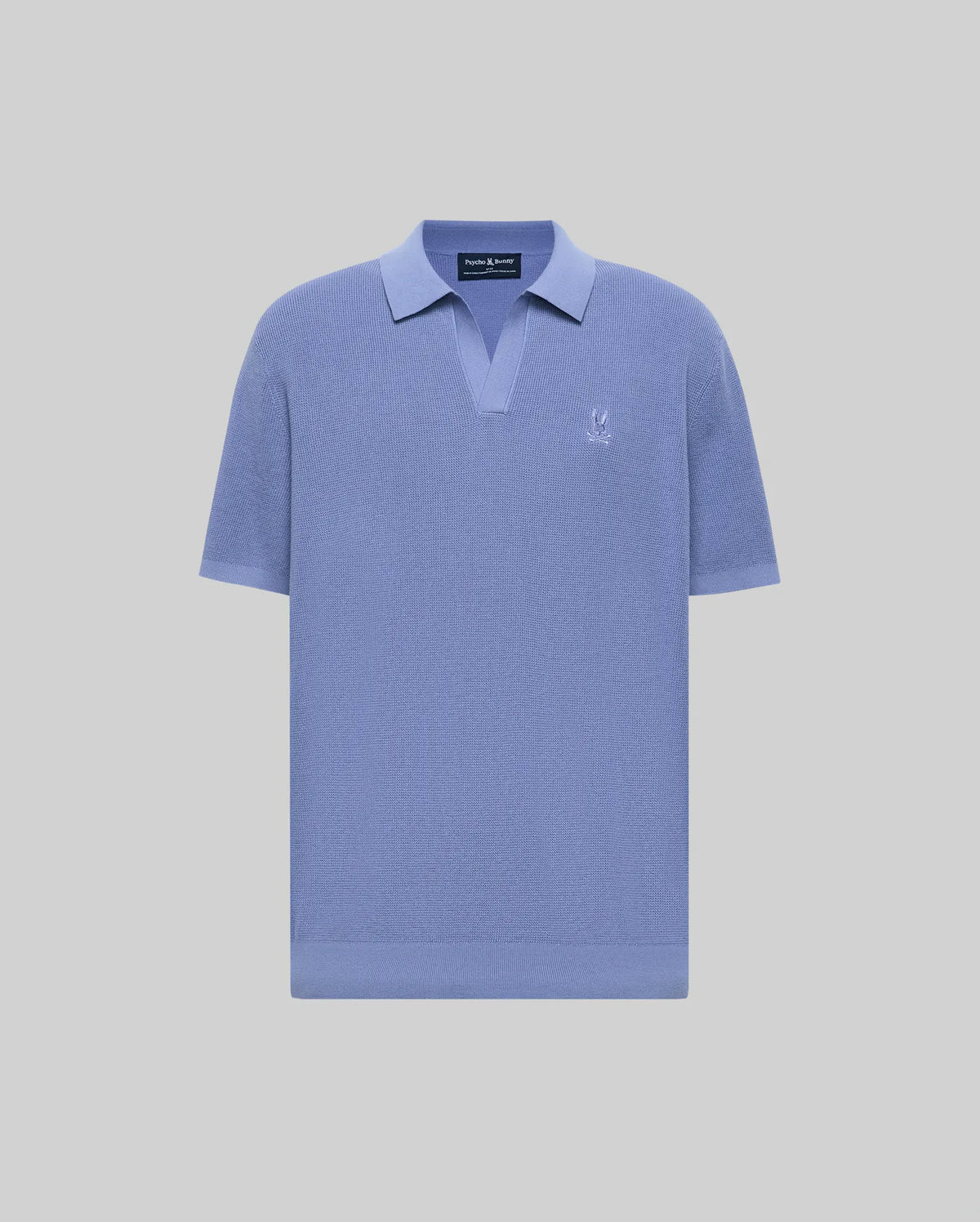 The Psycho Bunny MENS LEETON JOHNNY COLLAR KNIT POLO (B6E562F200) is a short-sleeved, light blue cotton sweater polo with a Johnny collar and small white logo on the left chest, shown on a plain light gray background.
