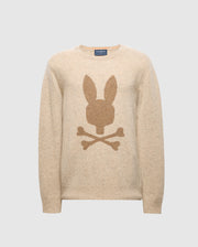 The Men's Lincoln Merino Wool Sweater by Psycho Bunny features a darker beige rabbit head and crossbones design across a plain light gray background. This sweater, ideal for cold weather, seamlessly blends style and comfort in its beige color.