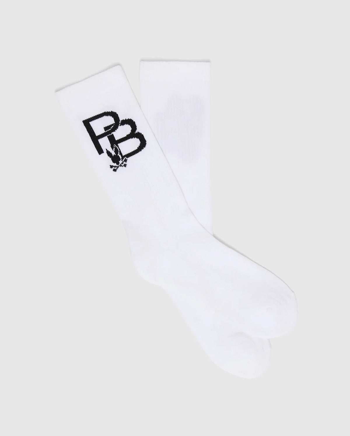 The MENS PB SPORT SOCK - B6F501F200 by Psycho Bunny features a sporty flex design with a black "PB" and rabbit graphic on white. Made from soft Pima cotton, these socks deliver comfort against a light gray background.