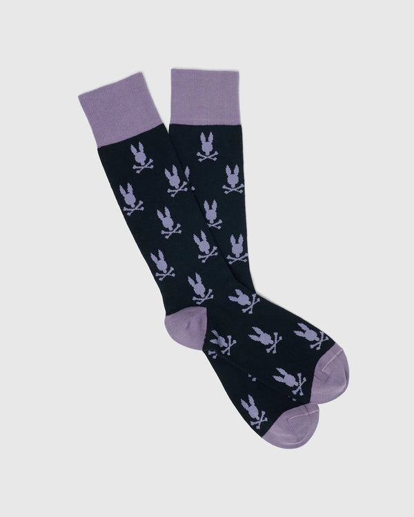 The Psycho Bunny MEN'S ALL OVER BUNNY DRESS SOCKS - B6F750F200 are knee-high, made from soft Pima cotton. They feature a dark base with light purple tops, heels, and toes, and are adorned with an abstract Knit Bunny pattern in light purple for a whimsical touch to your outfit.