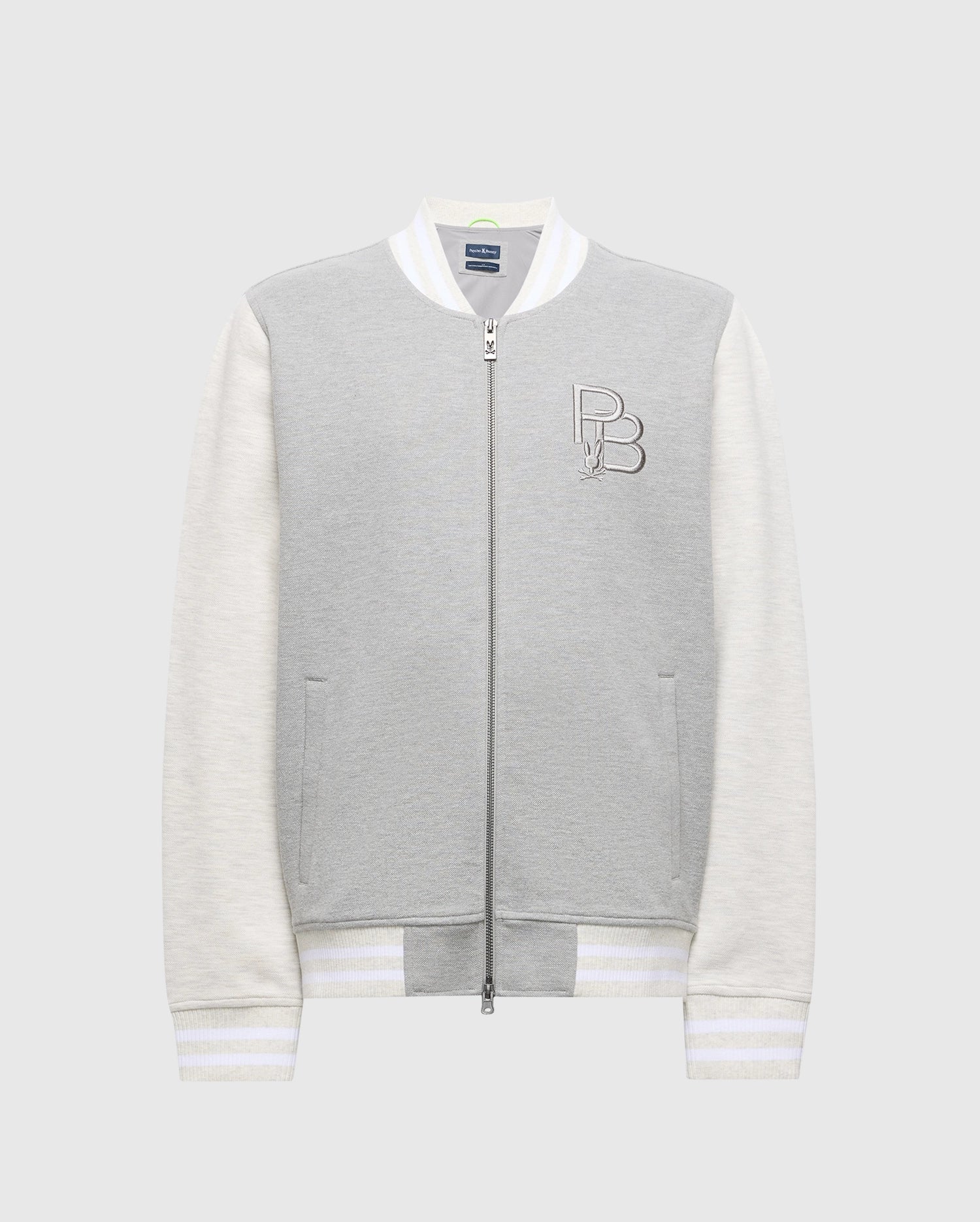 The MENS HYDRA COLOR BLOCK KNIT BOMBER - B6J455F200 by Psycho Bunny features a premium gray cotton-blend body and white sleeves, front zipper, "PB" logo on the left chest, and striped ribbed cuffs and hem for a classic look.