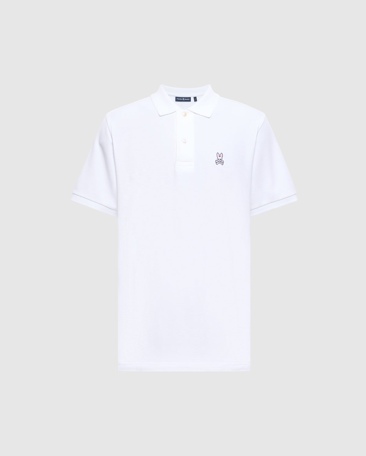 This Psycho Bunny Men's Classic Pique Polo Shirt, model B6K001ARPC, is designed with soft Pima cotton for comfort. It features short sleeves and a small embroidered Psycho Bunny logo on the chest, along with a classic collar and button placket for a timeless style.