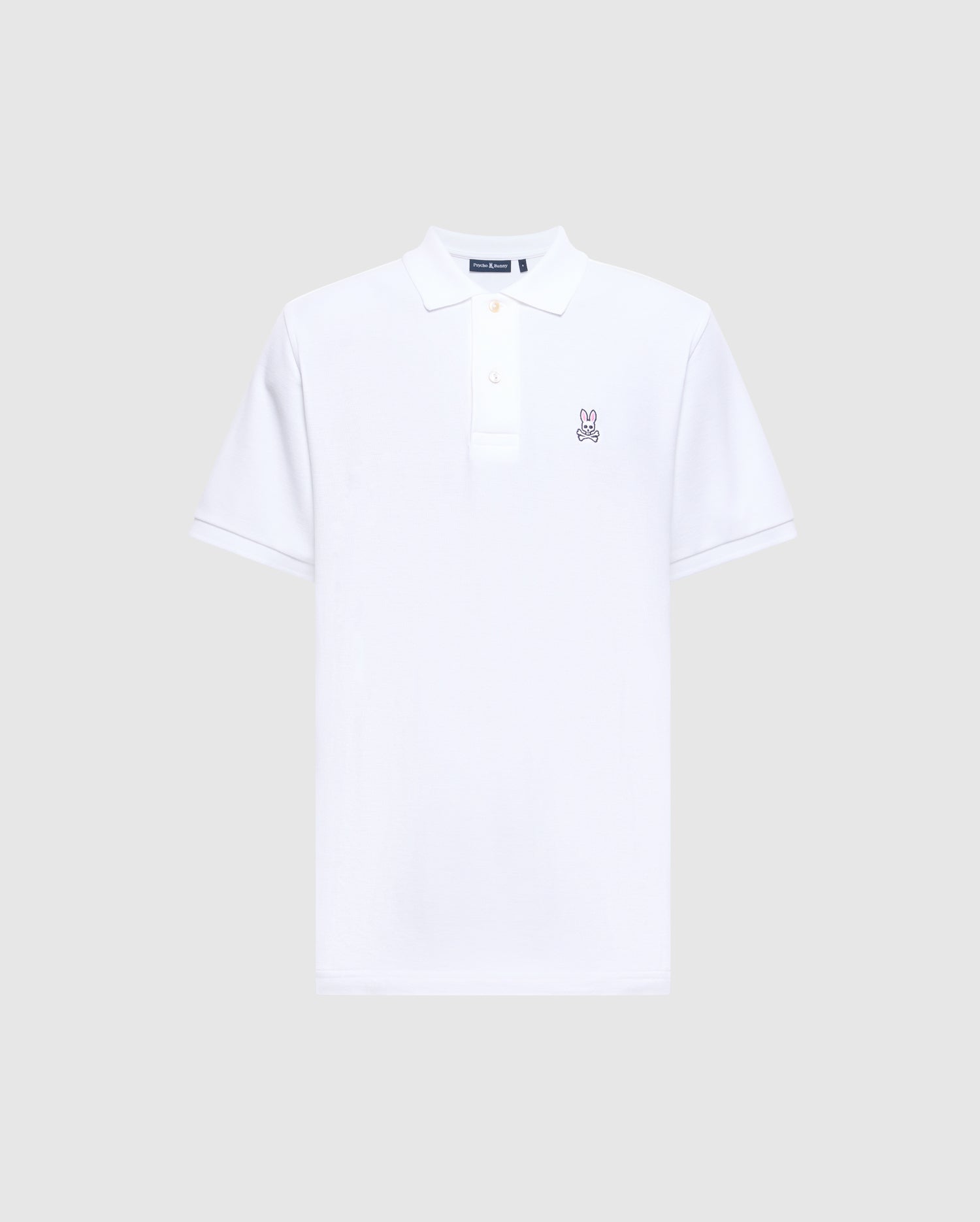 This Psycho Bunny Men's Classic Pique Polo Shirt, model B6K001ARPC, is designed with soft Pima cotton for comfort. It features short sleeves and a small embroidered Psycho Bunny logo on the chest, along with a classic collar and button placket for a timeless style.