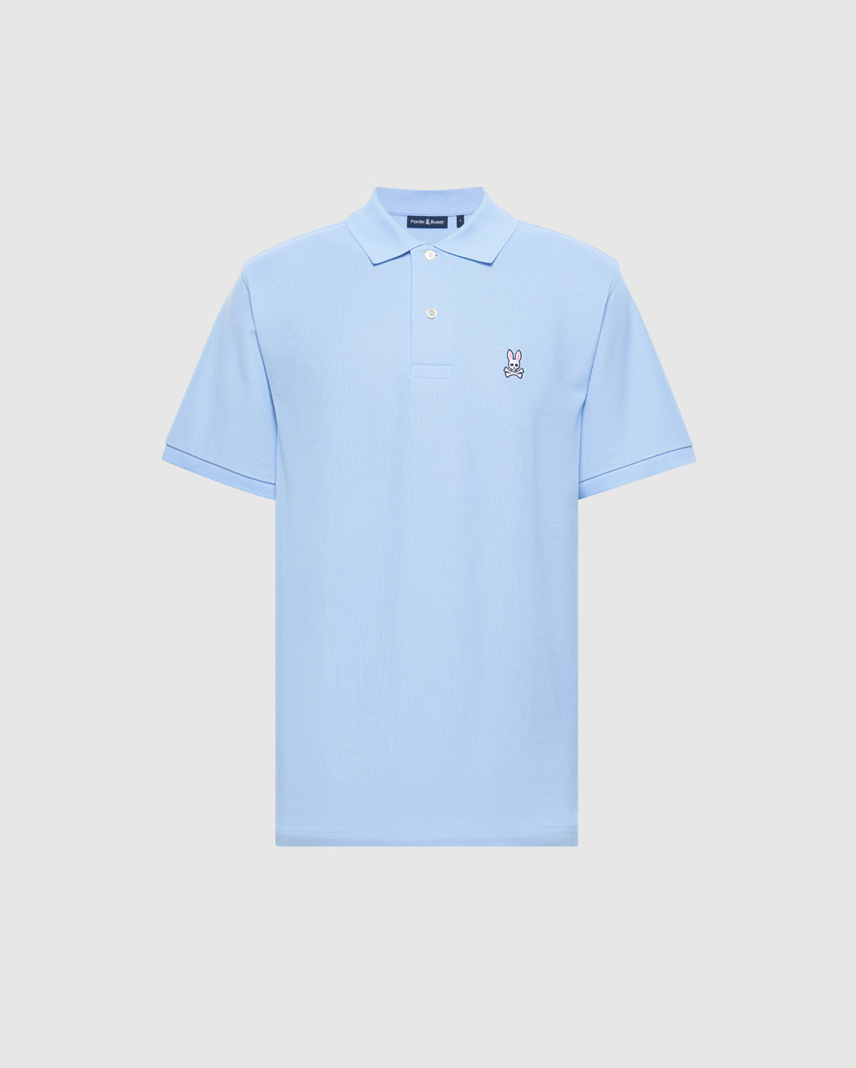 The Men's Classic Piqué Polo Shirt by Psycho Bunny (B6K001B200) in light blue is crafted from soft Pima cotton, featuring a small embroidered bunny logo on the left chest, with a classic collar and button placket for timeless style.