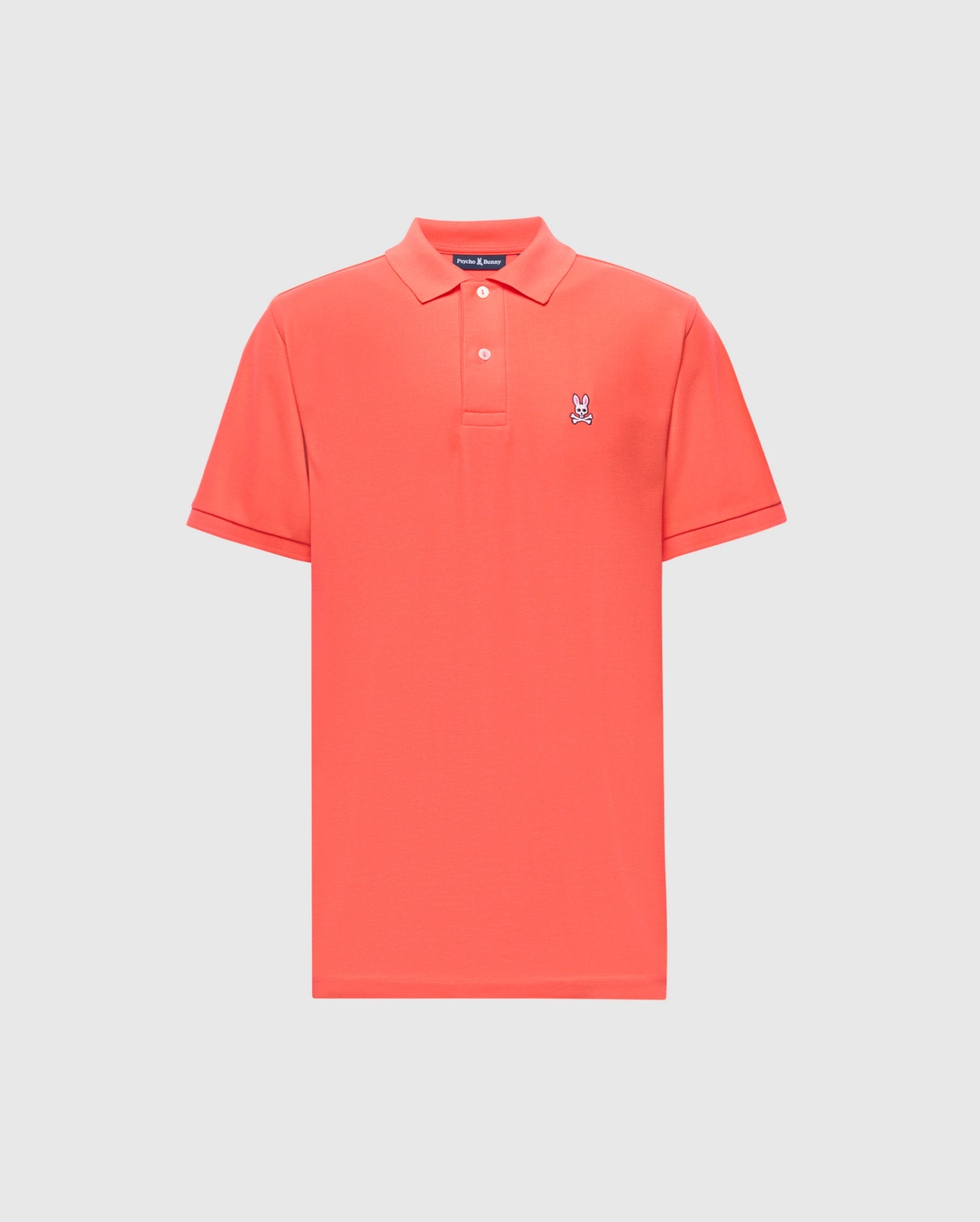 The Psycho Bunny MENS CLASSIC PIQUE POLO - B6K001F200 is a red shirt featuring a traditional collar and short sleeves, made from premium Pima cotton with an embroidered Bunny logo on the left chest, set against a plain white background.