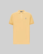 The Psycho Bunny MENS CLASSIC PIQUE POLO - B6K001F200 is a light yellow, short-sleeve Pima cotton polo with a collar, two buttons, and an embroidered Bunny logo on the left chest, set against a plain gray background.