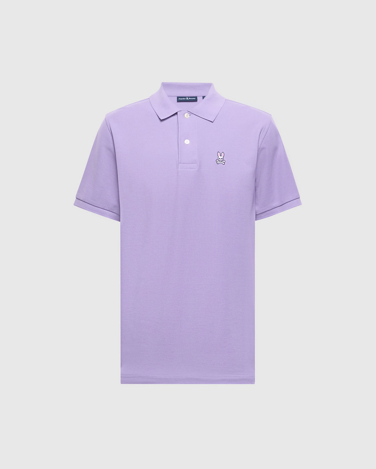 The Psycho Bunny Men's Classic Pique Polo Shirt (B6K001Z1PC) is a lavender short-sleeve made from soft Pima cotton, featuring a collar, three buttons, and the embroidered Bunny logo on the left chest.