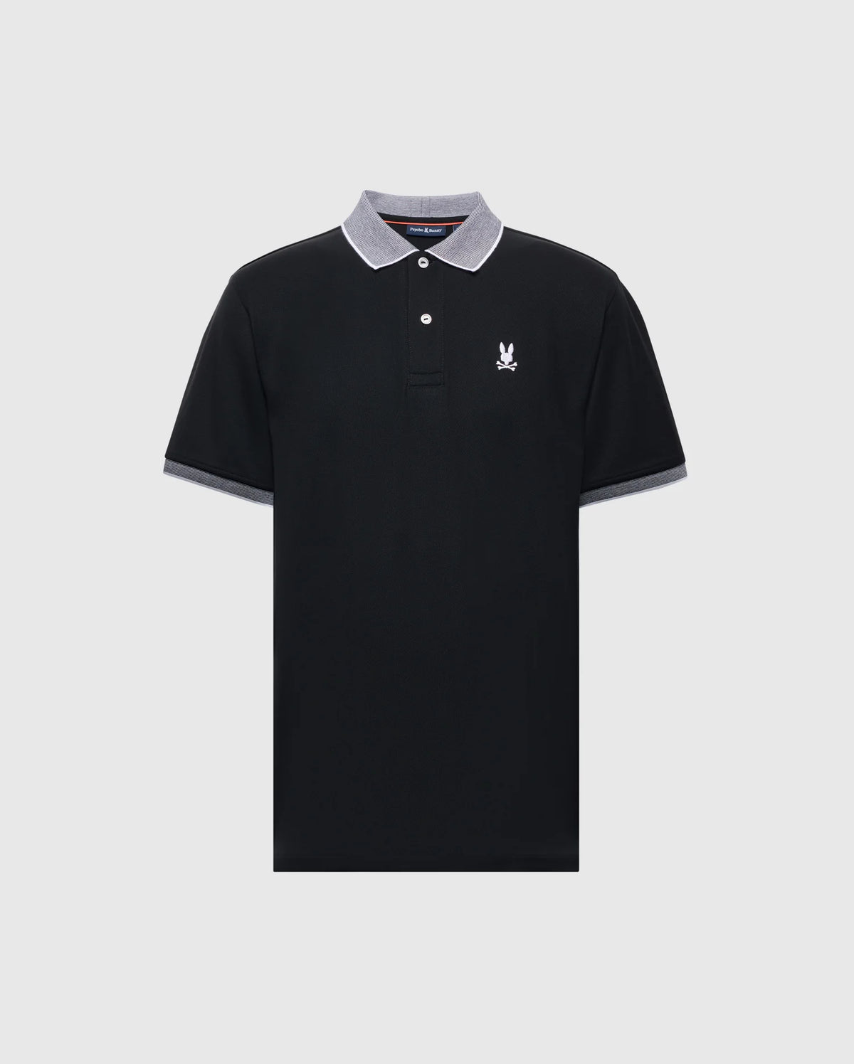 The Psycho Bunny MENS JONAS STRIPE COLLAR PIQUE POLO - B6K583F200 is crafted from luxurious Peruvian Pima Cotton, featuring a black design with a gray-collared micro-striped edge, two buttons, and a small white emblem on the left chest for an effortlessly sleek look.