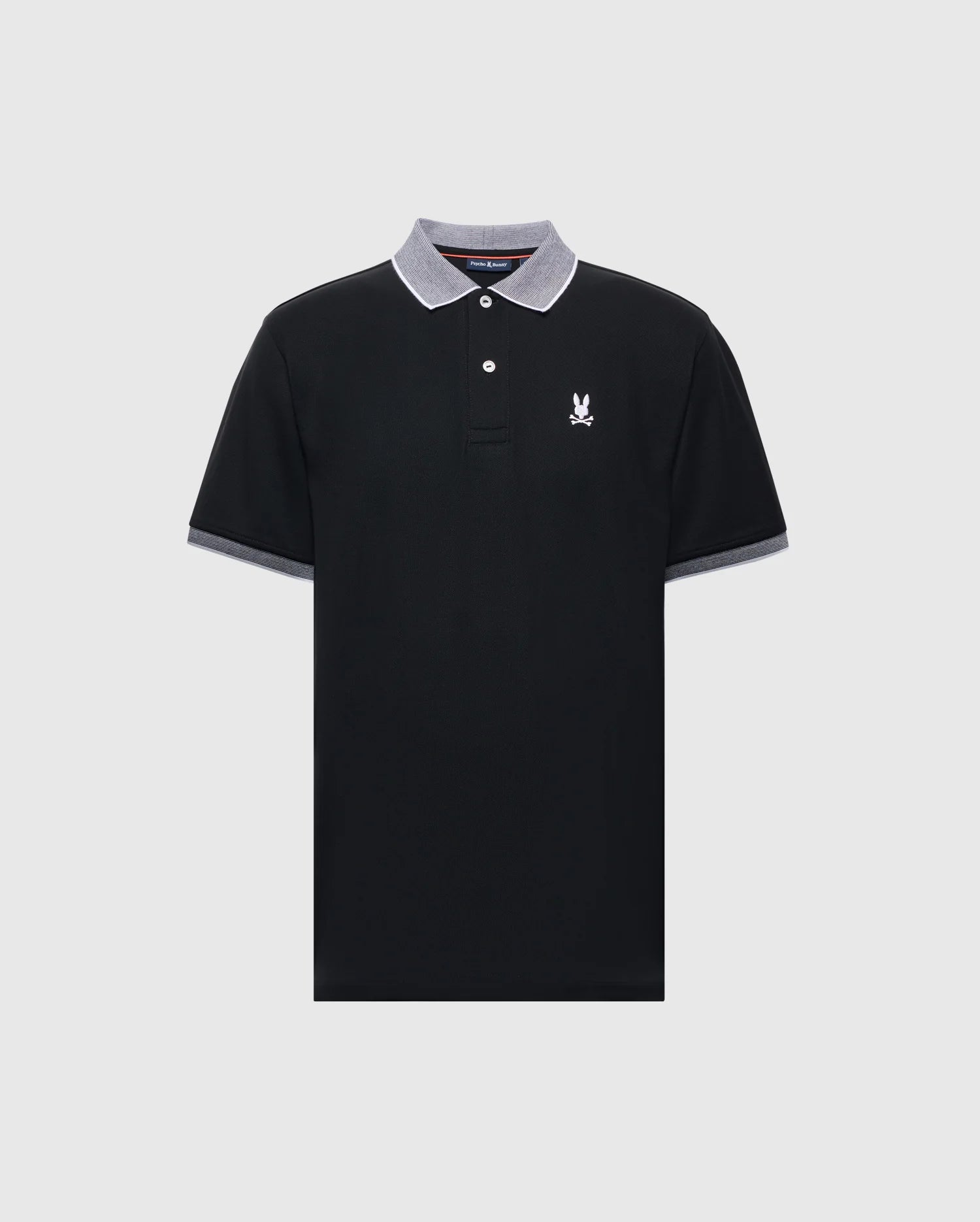 The Psycho Bunny MENS JONAS STRIPE COLLAR PIQUE POLO - B6K583F200 is crafted from luxurious Peruvian Pima Cotton, featuring a black design with a gray-collared micro-striped edge, two buttons, and a small white emblem on the left chest for an effortlessly sleek look.