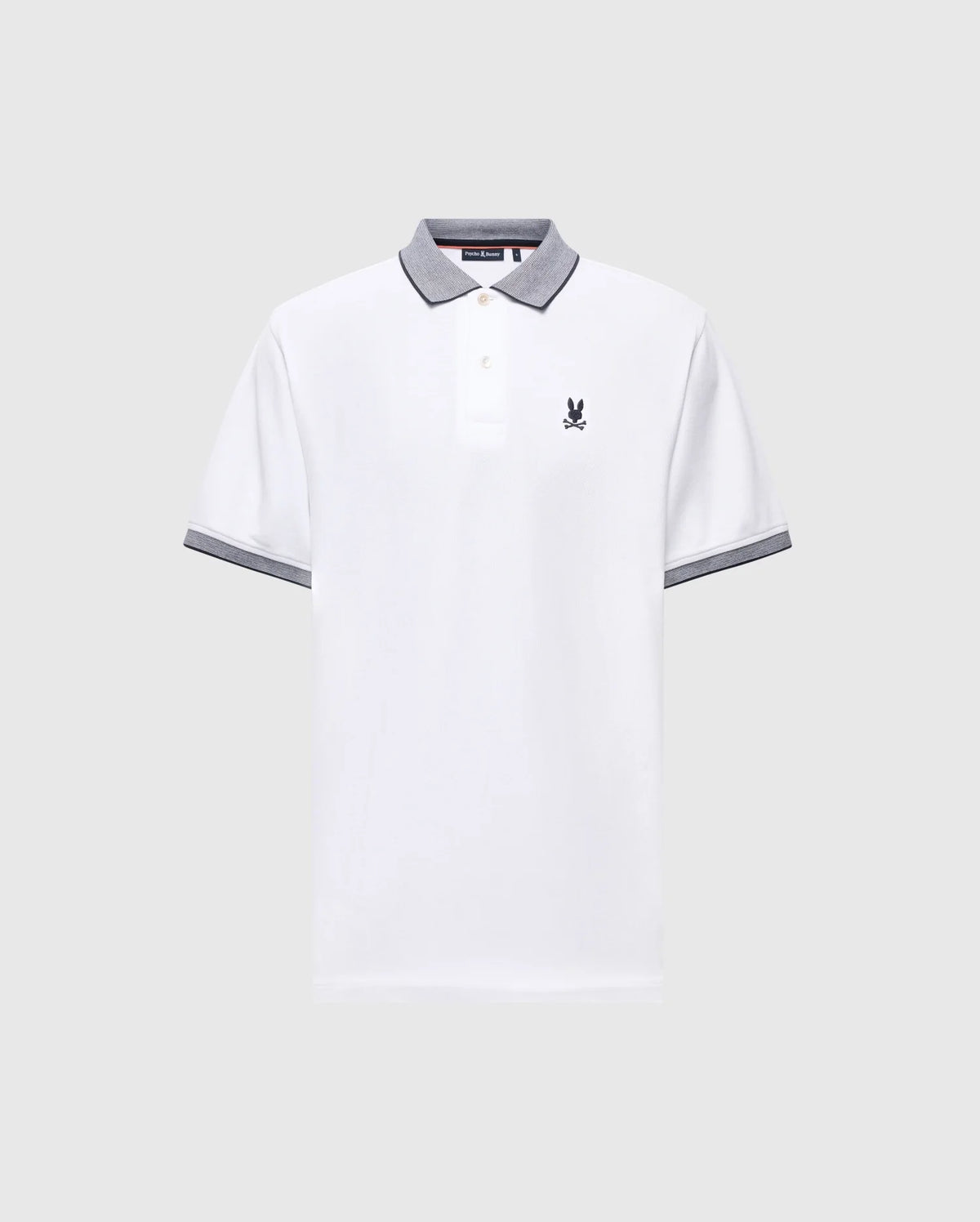 The Psycho Bunny MENS JONAS STRIPE COLLAR PIQUE POLO (B6K583F200) features white Pima cotton, gray striped trim on the collar and cuffs, a buttoned placket, and a small embroidered logo on the left chest. Displayed on light gray background.
