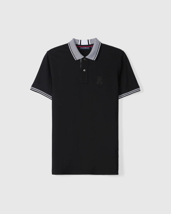 The MENS MALTON PIQUE POLO SHIRT - B6K950D200 by Psycho Bunny is a black Pima cotton polo with gray accents on the collar and cuffs. It features a small, dark thread embroidered design on the left chest. The shirt has a three-button placket and is made of smooth, lightweight fabric.