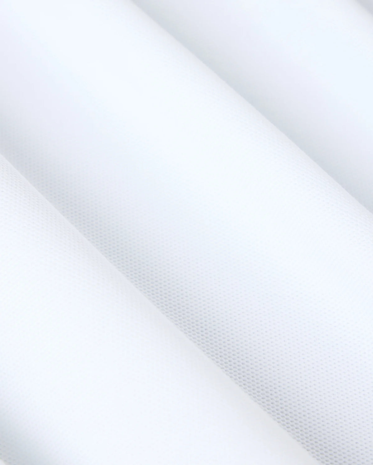 Close-up of the MENS MALTON PIQUE POLO SHIRT - B6K950D200 by Psycho Bunny, showcasing a white textured surface with subtle diagonal lines and a sophisticated dotted diamond pique pattern, creating a minimalist and clean aesthetic reminiscent of refined detail.