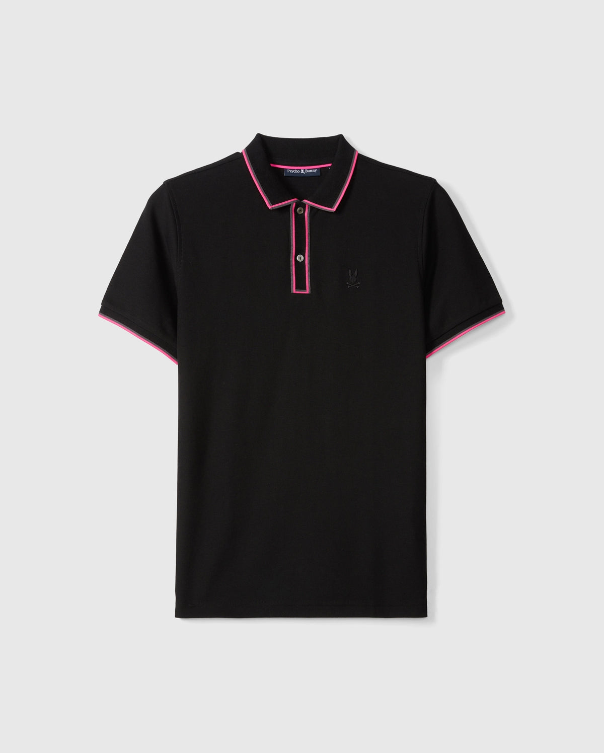 The MENS KENT PIQUE POLO SHIRT - B6K951D200 by Psycho Bunny is a stylish black polo shirt featuring pink trim on the collar and sleeve edges. Made from comfortable pique cotton, it includes a three-button placket and a small embroidered logo on the chest. Laid flat against a plain background, its sleek design truly stands out.