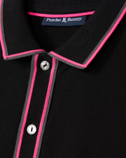 Close-up of the MENS KENT PIQUE POLO SHIRT - B6K951D200, showcasing a chic black design with pink and gray accents on the collar and button placket. Featuring two visible buttons and an interior "Psycho Bunny" label, this shirt is crafted from comfortable pique fabric, ideal for those who value fashion-forward elegance.