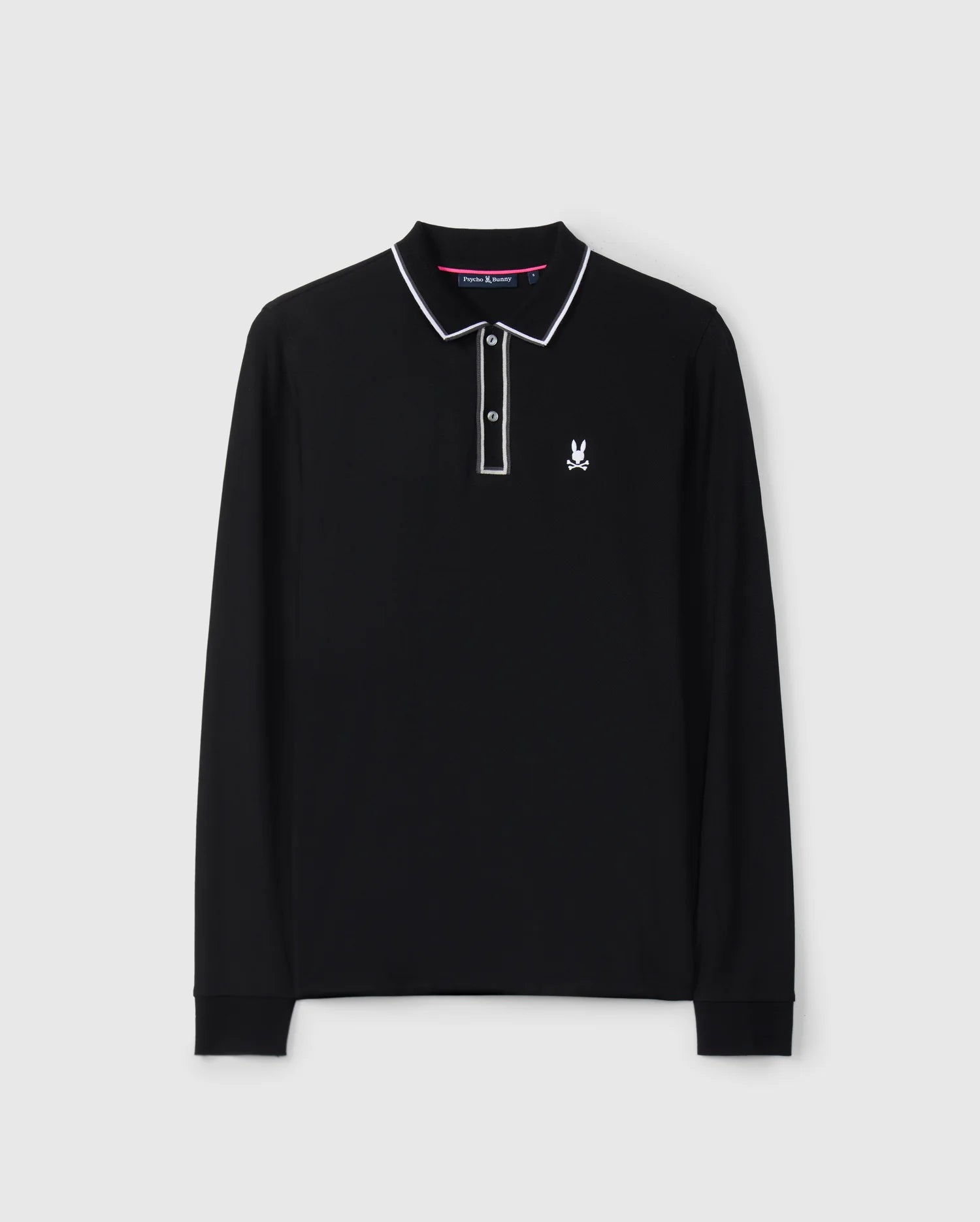 The Psycho Bunny Men's Kent Long Sleeve Pique Polo, product code B6M935D200, is crafted in luxurious black Pima cotton and features a striking white trim on the collar and sleeve cuffs. This polo embodies understated luxury with its small embroidered logo of a bunny with crossbones on the chest, set against a plain white background.