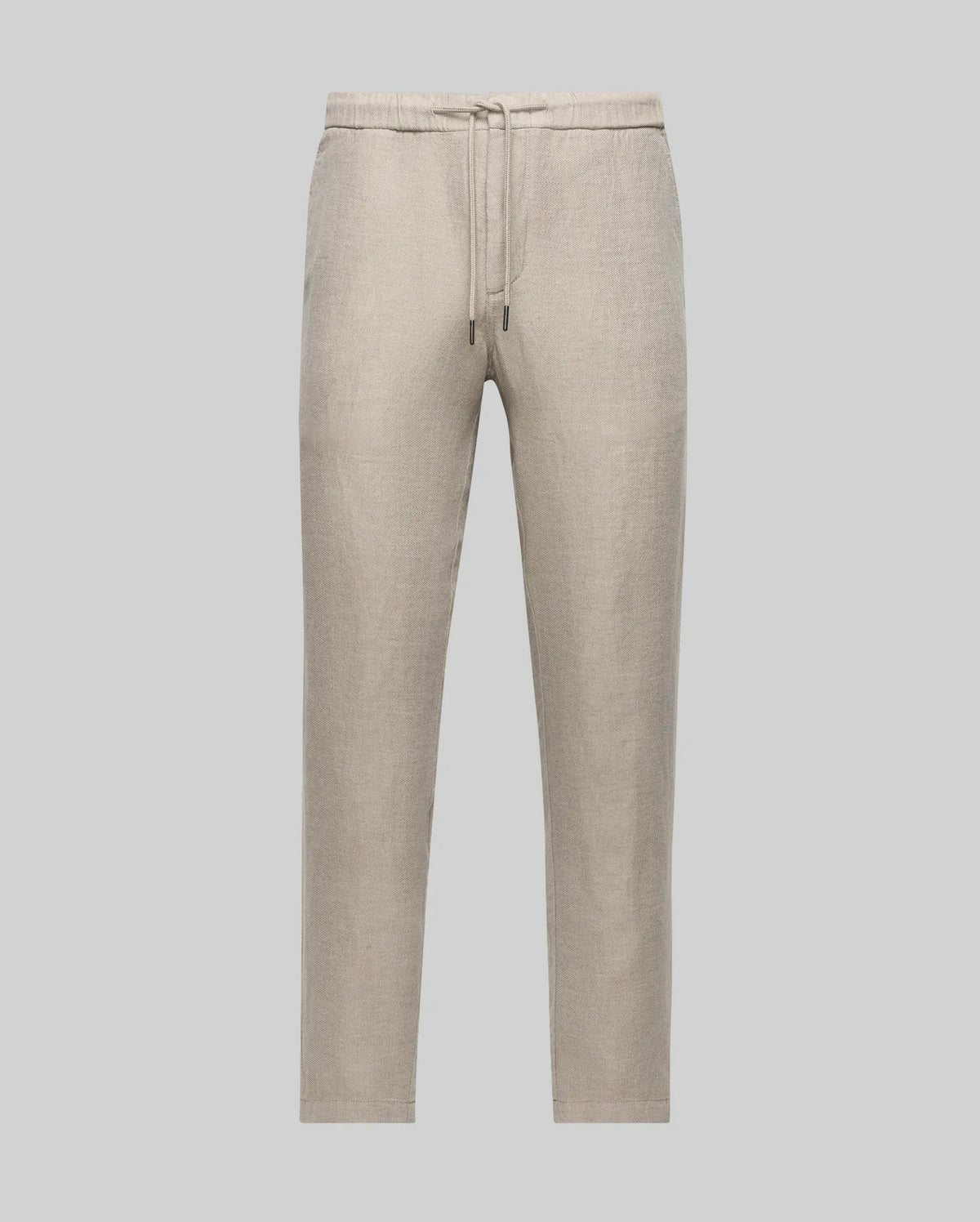 The Psycho Bunny MENS FATE LINEN DRAWSTRING PANT (B6P471C200) features light beige linen-blend fabric, a drawstring waist, and straight legs for cool comfort, shown against a plain light gray background.