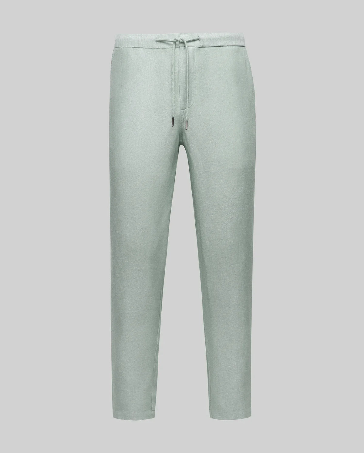 The Psycho Bunny MENS FATE LINEN DRAWSTRING PANT (B6P471C200) in light green features a tapered leg and cooling premium linen blend, shown on a plain gray background.