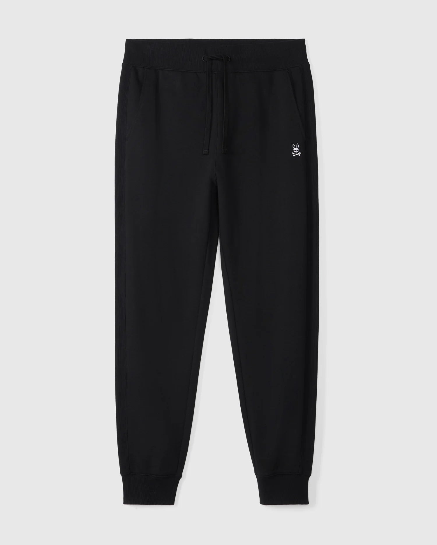 The MENS LEVY ESSENTIAL FLEECE SWEATPANT - B6P721D200 by Psycho Bunny are black cotton sweatpants featuring a drawstring waistband, tapered cuffs, and a small embroidered logo on the upper left thigh. Perfect for casual wear, these comfy fleece sweatpants are displayed on a plain white background.