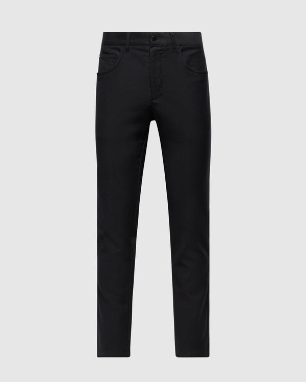 The MENS HAYS TWILL PANT - B6P894D200 by Psycho Bunny is pictured on a light gray background, showcasing its black slim-fit design made from a cotton-blend twill. The front view emphasizes the button closure and five-pocket style for maximum comfort.