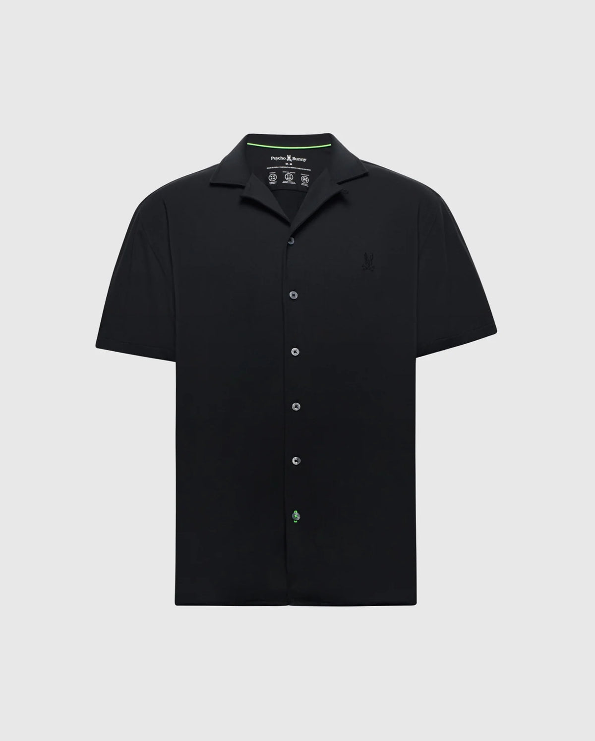The Psycho Bunny MENS BRYAN CAMP COLLAR SHORT SLEEVE SHIRT (B6Q581F200) is a black Pima cotton blend button-up with a classic camp collar. It features an embroidered chest logo and offers style and moisture-wicking comfort in a simple design against a white background.