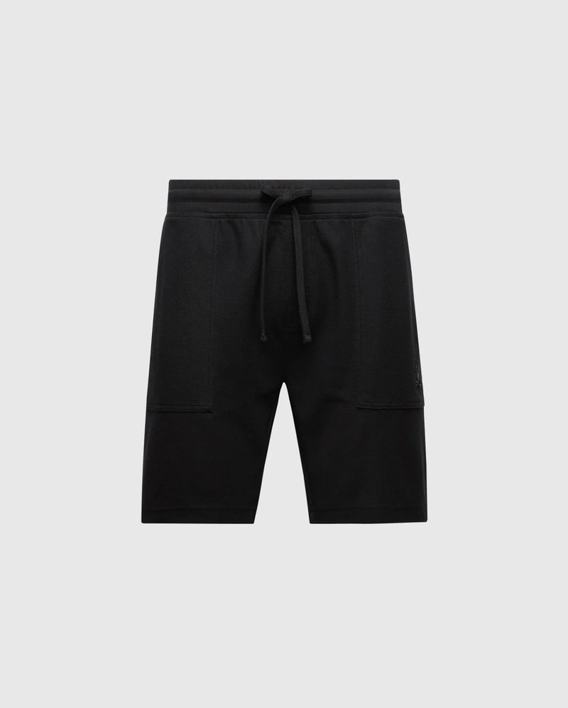 Introducing Psycho Bunny's MENS TAYLOR LIGHT PIQUE SWEATSHORT - B6R344F200, crafted from luxurious Pima cotton in black. These shorts feature a drawstring, two side pockets, and an embroidered Bunny logo on the left for casual-chic comfort against a plain light gray background.