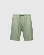 The MENS TAYLOR LIGHT PIQUE SWEATSHORT - B6R344F200 by Psycho Bunny are light green athletic shorts made from lightweight Pima cotton, featuring an elastic waistband with drawstring, two front pockets, and a subtle logo on the left side.