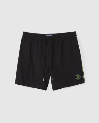 A pair of MENS SONTERRA STRIPE SPORT SHORT - B6R464C200 by Psycho Bunny, featuring an elastic waistband with a drawstring. Made from stretch fabric, they offer two side pockets and a small, round logo on the bottom-left leg. The shorts have subtle green trim along the sides.