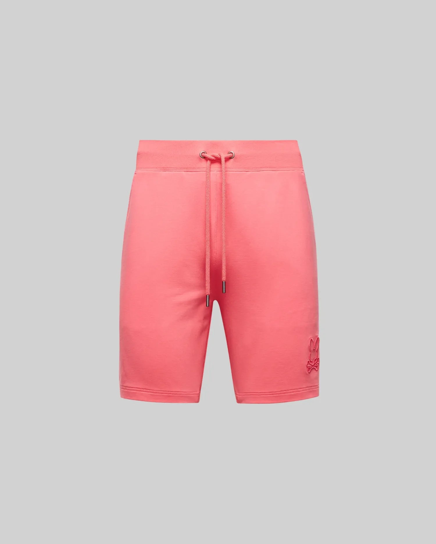 The Psycho Bunny Mens Levanzo Embroidered Micro French Terry Sweatshort (B6R578F200) in coral pink features an elastic waistband, drawstring, and a raised Bunny logo on the lower left leg, shown against a plain light grey background.