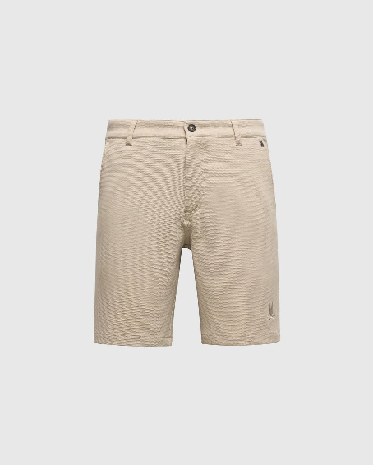 The Psycho Bunny MENS SHIRO KNIT HONEYCOMB SHORT (B6R585F200) is a beige, honeycomb-patterned piqué short with belt loops, front button and zipper closure, and a small embroidered logo near the left hem, shown on a white background.