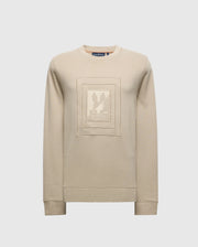 The MENS OAK CITY CREW NECK - B6S274E200 by Psycho Bunny is a beige, lightweight sweatshirt with a crew neckline and ribbed cuffs. It features a raised embroidery square design on the front with an abstract graphic at the center.