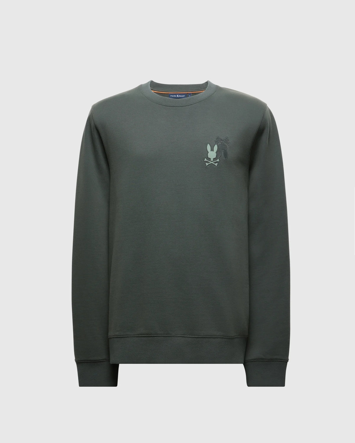 The MENS WORDMARK PEACHED TERRY CREW - B6S278E200 by Psycho Bunny is a dark green knit cotton pullover featuring a subtle embroidered graphic of bunnies on the upper left chest area. It has a classic crew neckline, ribbed cuffs, and a plain white background.