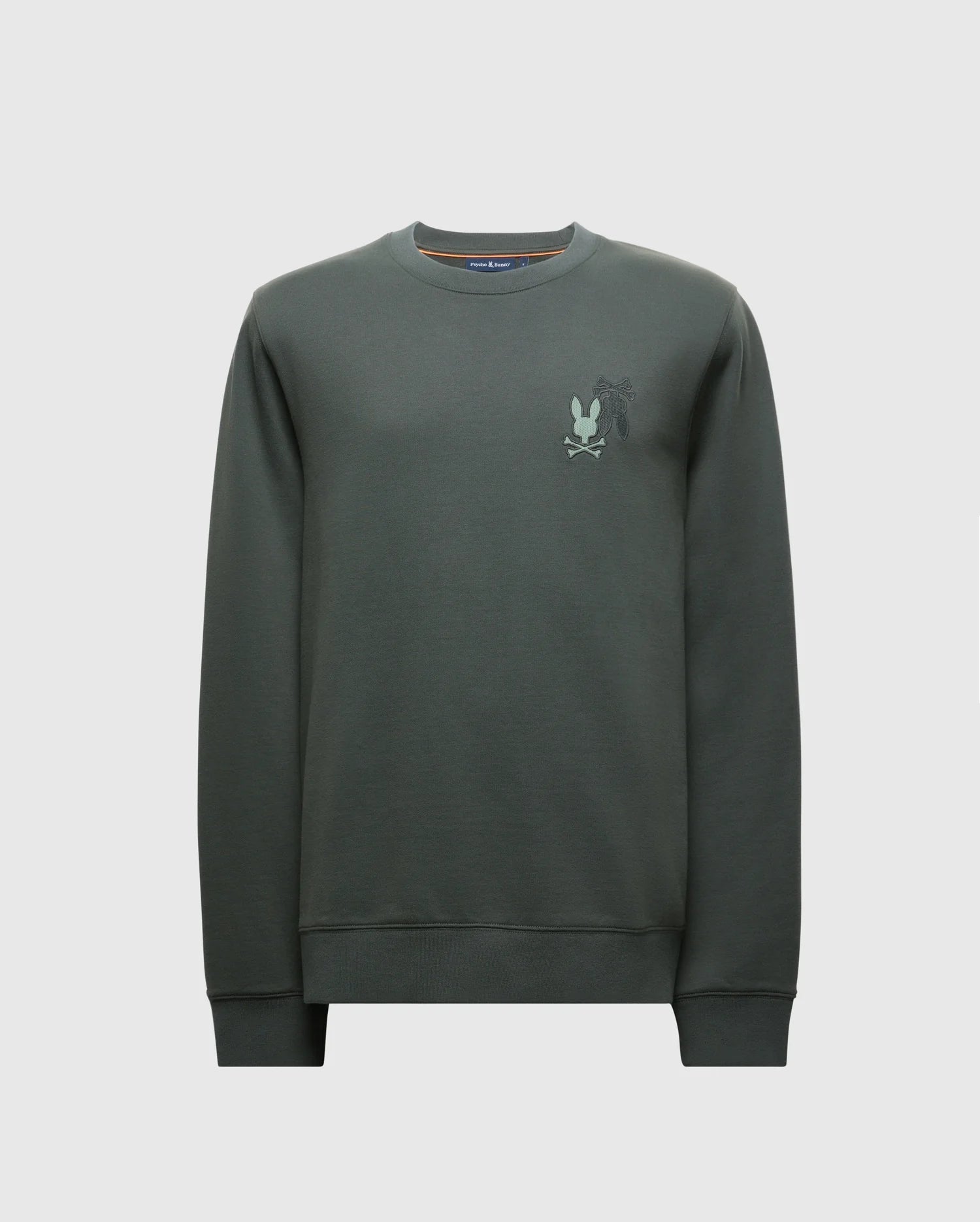 The MENS WORDMARK PEACHED TERRY CREW - B6S278E200 by Psycho Bunny is a dark green knit cotton pullover featuring a subtle embroidered graphic of bunnies on the upper left chest area. It has a classic crew neckline, ribbed cuffs, and a plain white background.